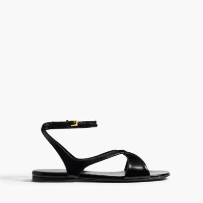 Khaite Liria Ankle Strap Flat Sandal in Black Glazed Leather - Image 1