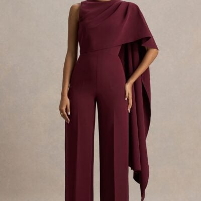 Club L London Sorenia | Burgundy High-Neck Jumpsuit With One-Cape Sleeve - Image 1