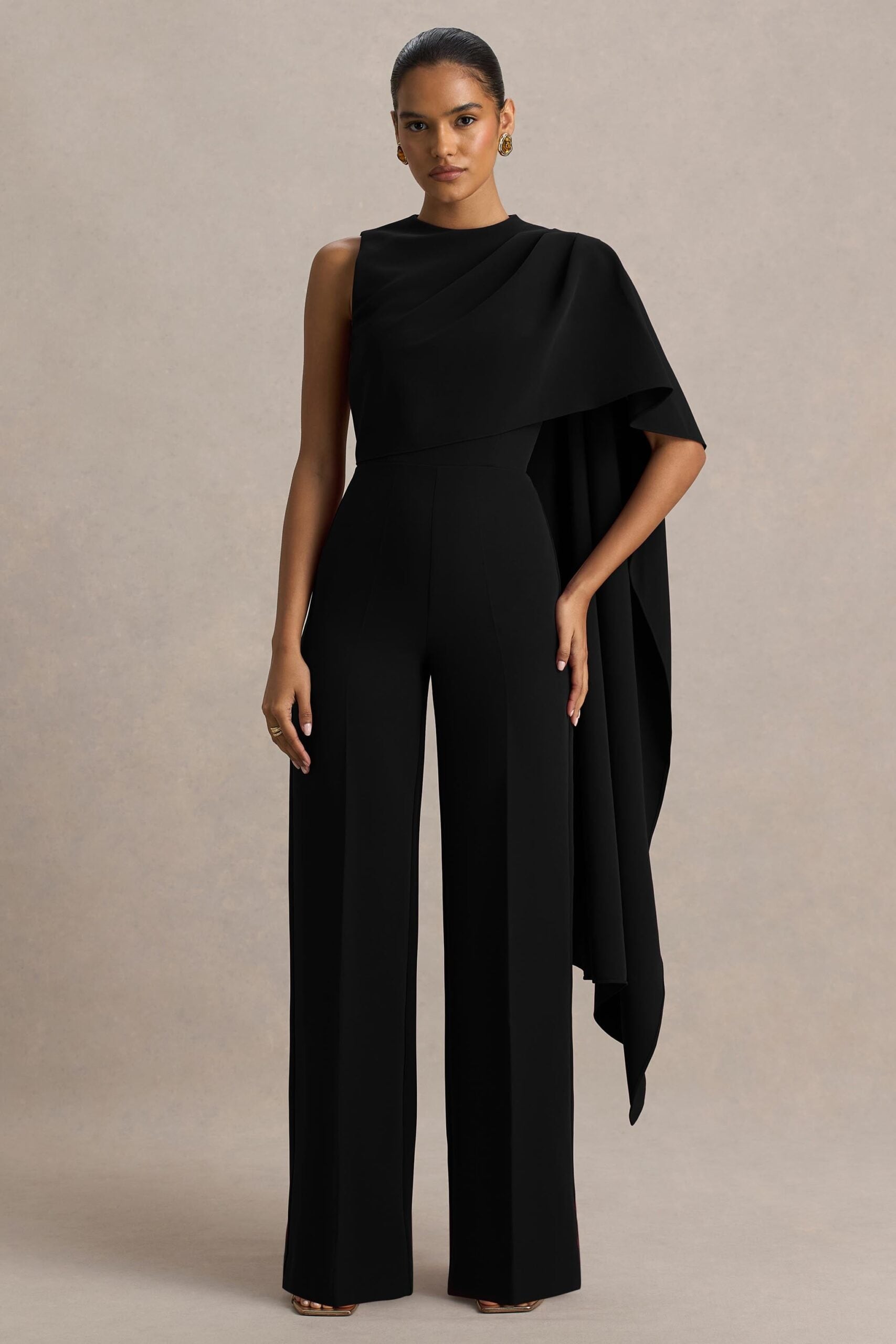 Club L London Sorenia | Black High-Neck Jumpsuit With One-Cape Sleeve - Image 1