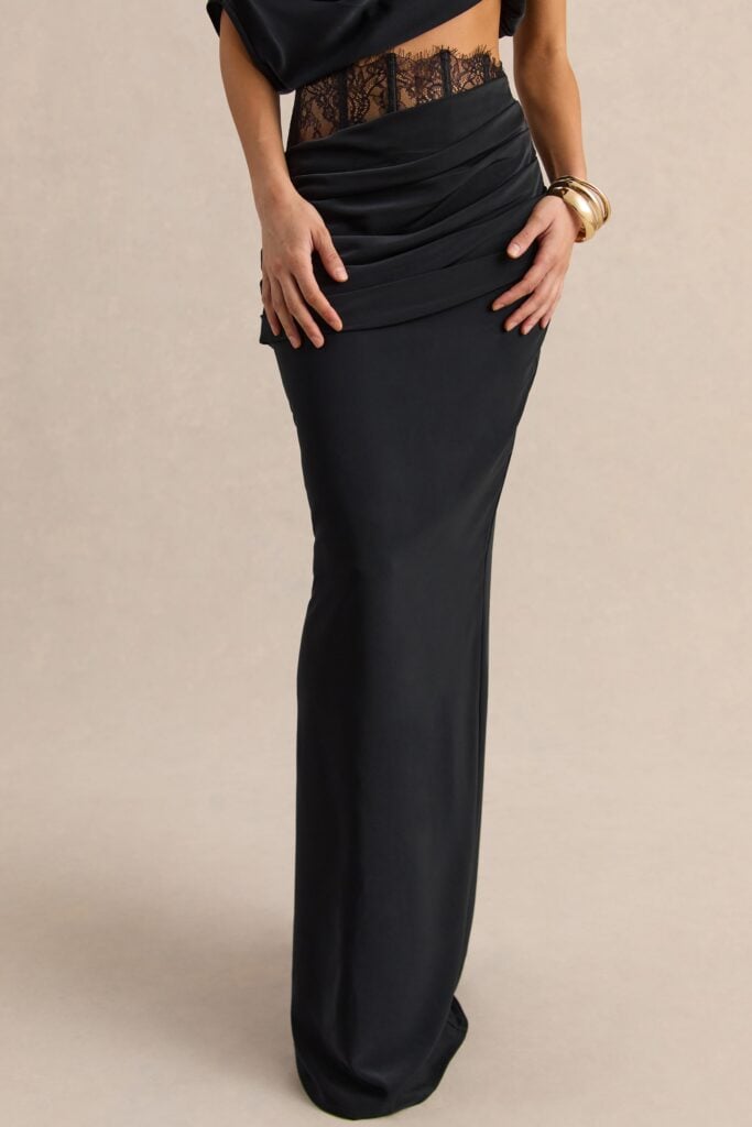 Club L London Silora | Black Satin Mid Rise Maxi Skirt With Sheer Lace Panel And Draped Detailing - Image 1