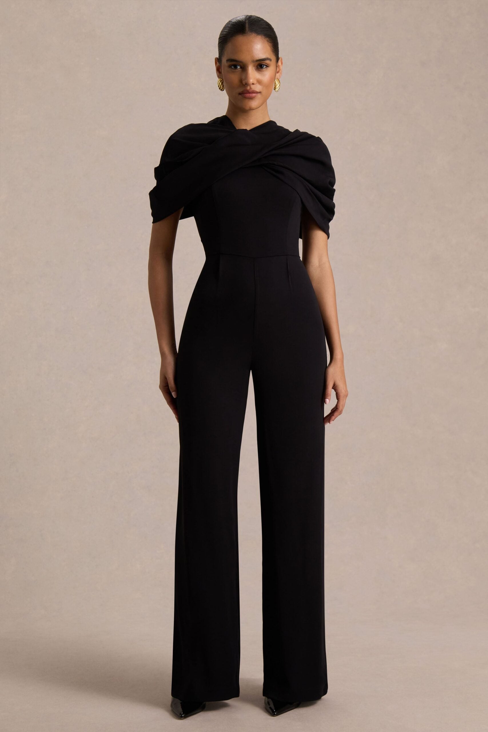 Club L London Raquel | Black Asymmetric-Neck Jumpsuit With Twisted Cape Detail - Image 1