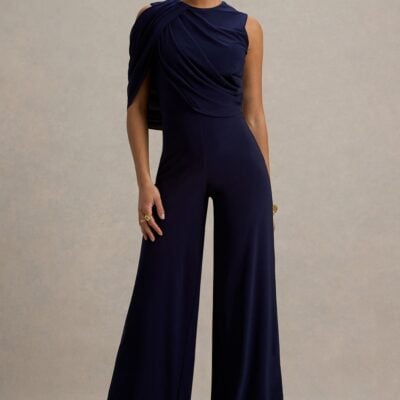 Club L London Opulence | Navy Jumpsuit With Cape Sleeve and Draped Details - Image 1