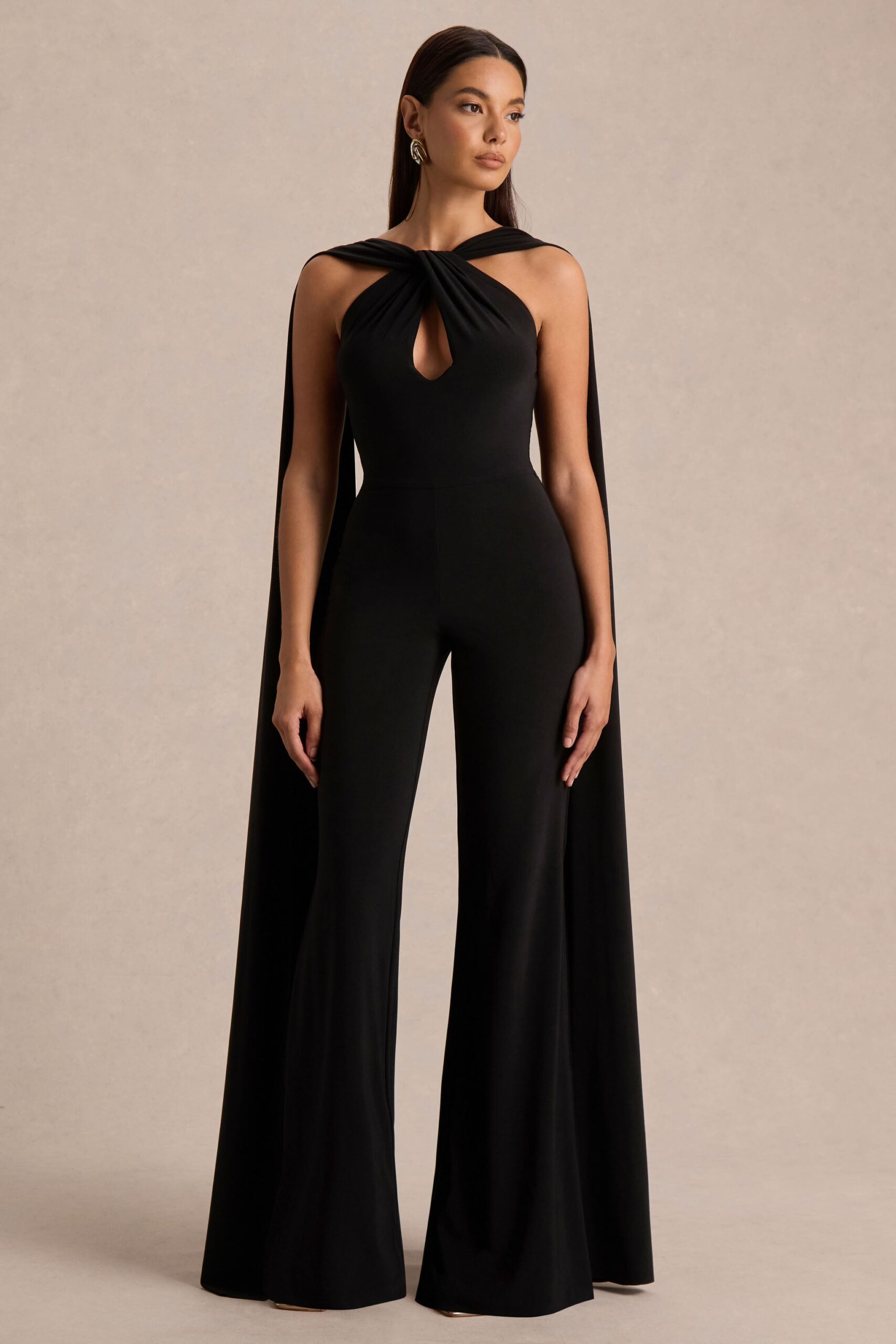 Club L London Mindy | Black Twist Halter-Neck Jumpsuit With Cape - Image 1